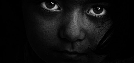 bw photo of child in darkness