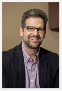 portrait: white man with beard, mustache and glasses, brown hair