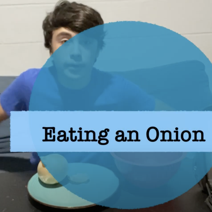 man eating an onion